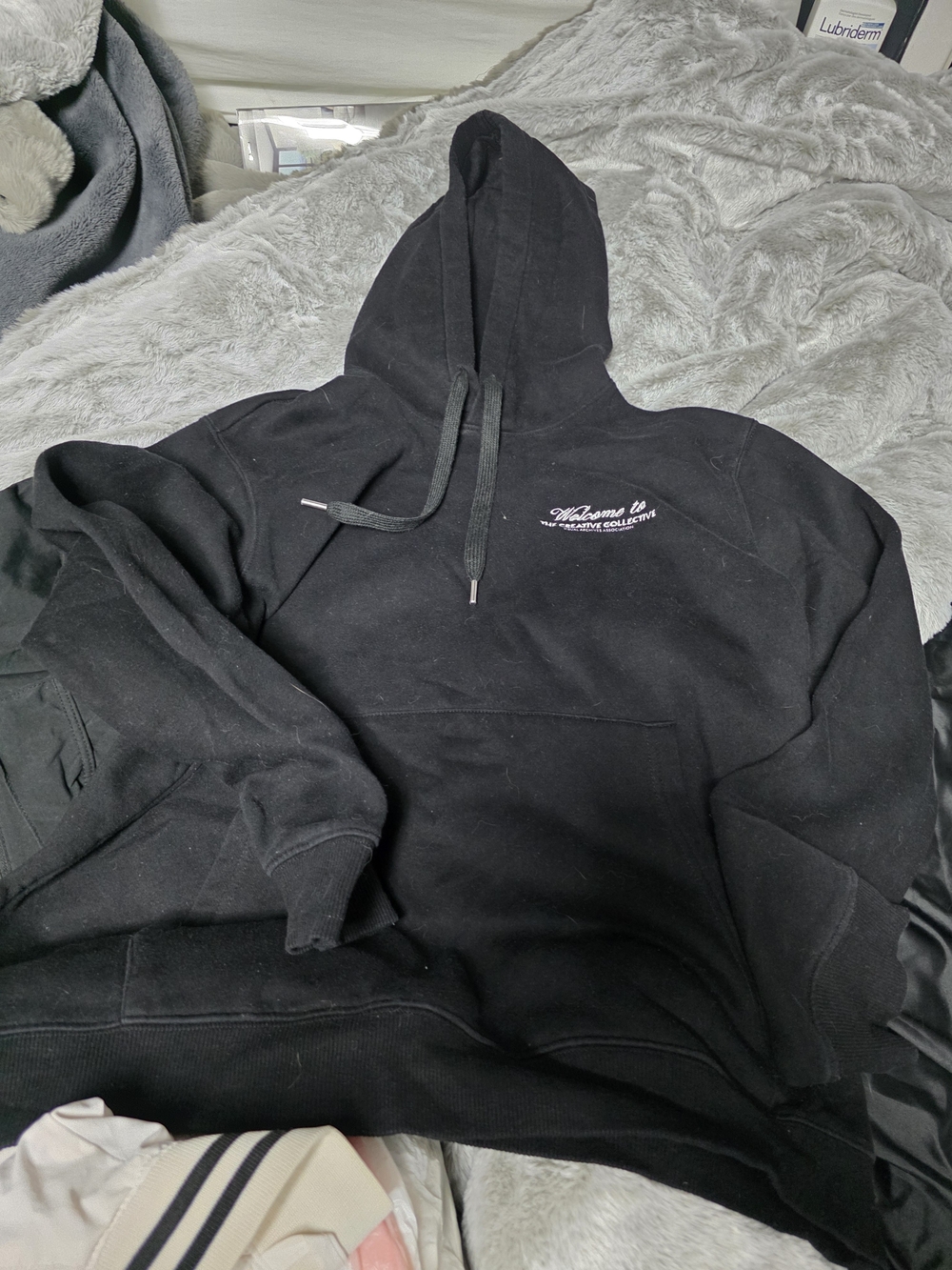 H&M Black Hoodie with Small White Chest Script